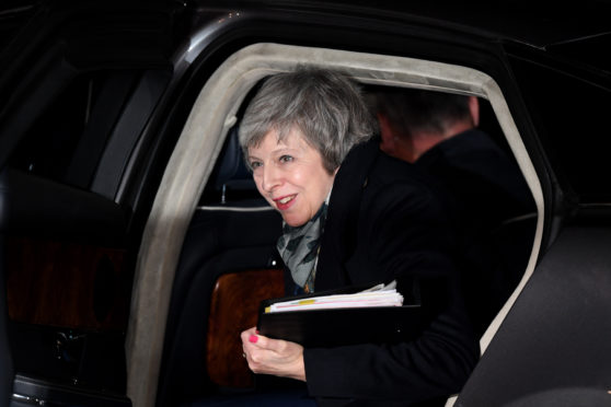 Prime Minister Theresa May returns to Downing Street after the Confidence Vote
