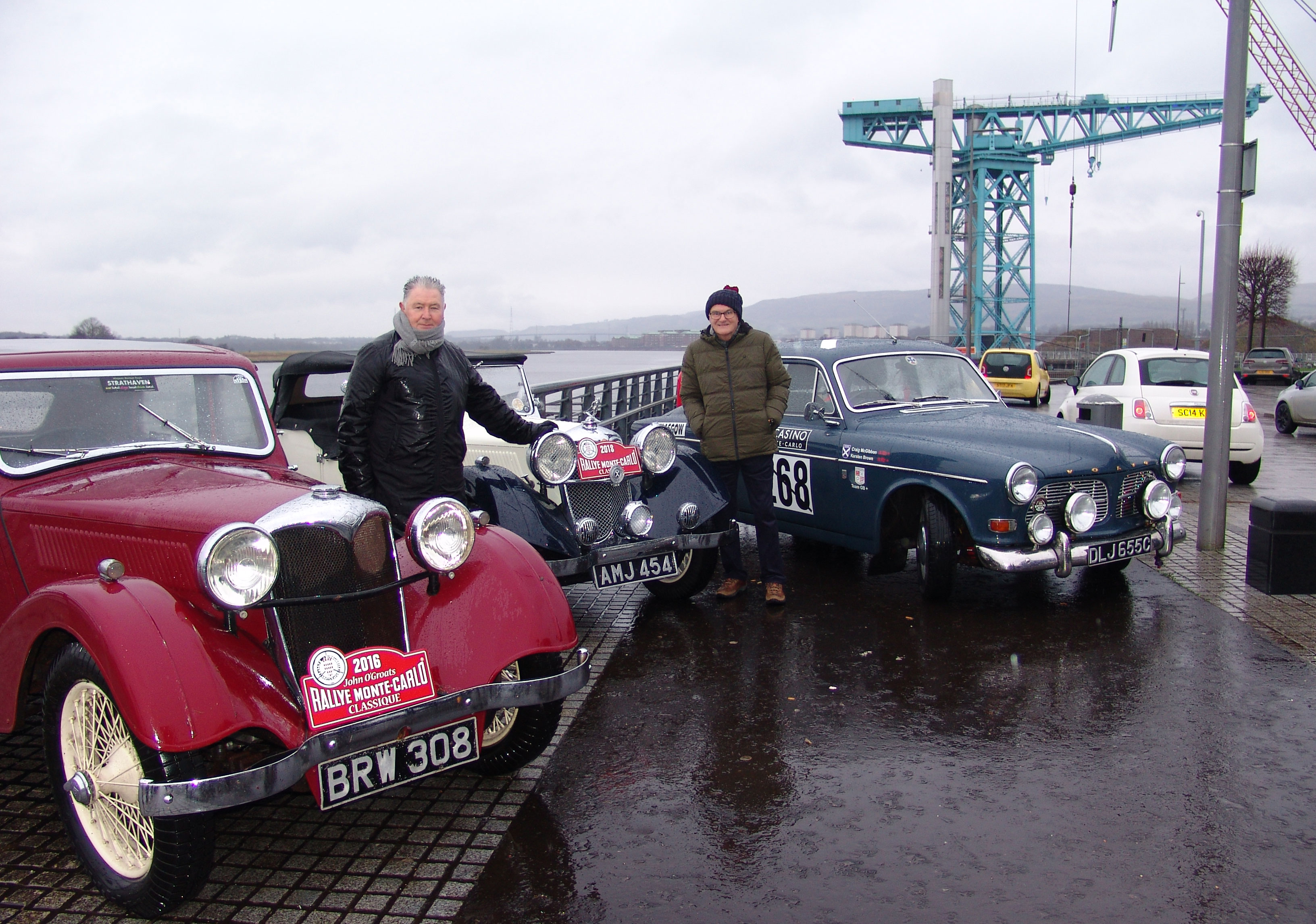 Bailie Denis Agnew of West Dunbartonshire Council (left) and UK coordinator Douglas Anderson with two classic Rileys and a Volvo Amazon at the start of theb