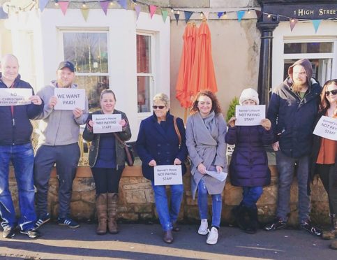 Staff protesting outside the hotel.