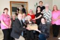 Dr Bill Lynch, Vivian Tait and Leonie Paterson are centre stage with staff at Orchar Nursing Home in Broughty Ferry