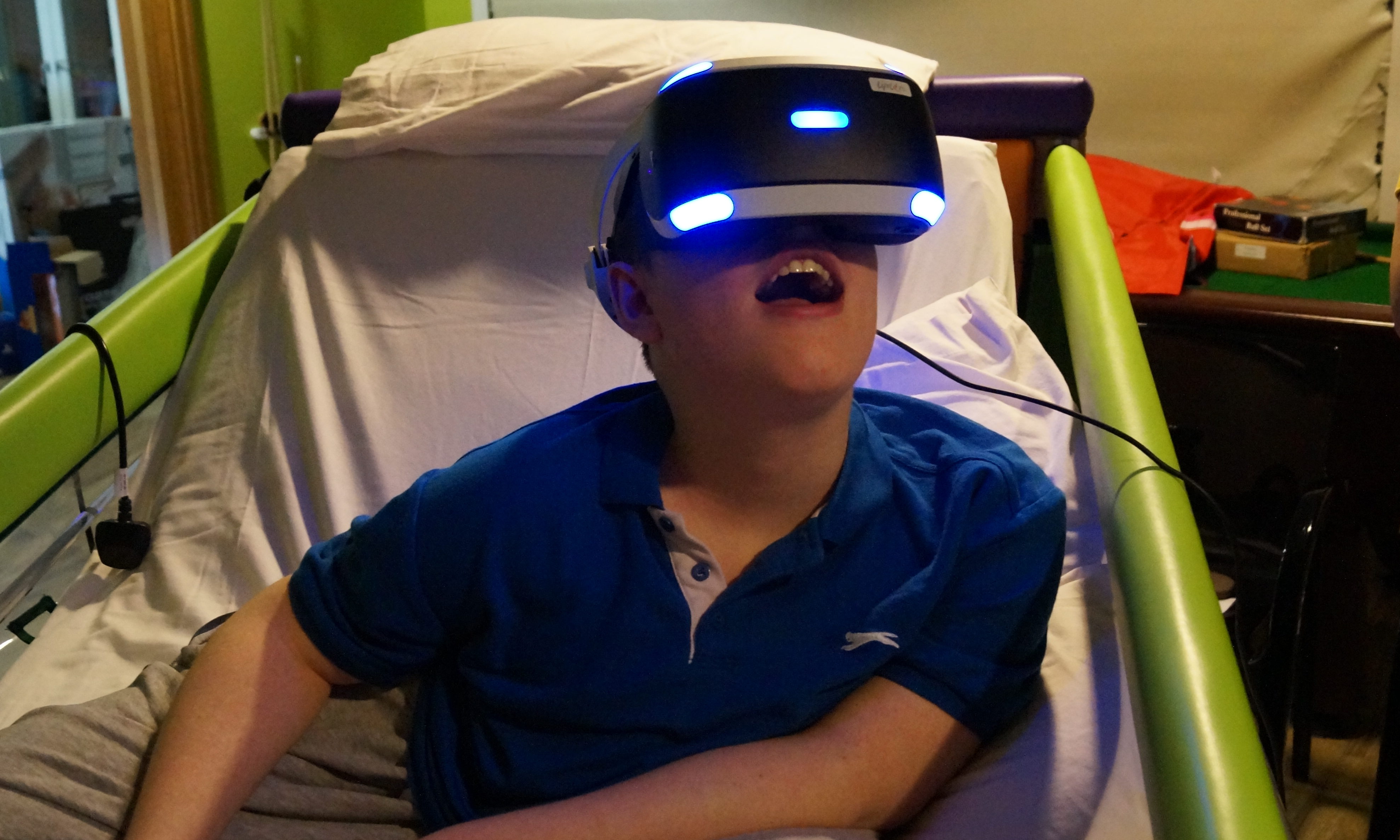 Youngster Jack tries out the VR technology at Rachel House