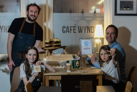 Champion award winner Stewart Forrest with Plastic-Free Dunfermline founder James Daw and Amelia and Maisie Daw​.