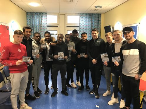 Some of the Dundee FC players at Ninewells promoting Beards for Bairns.