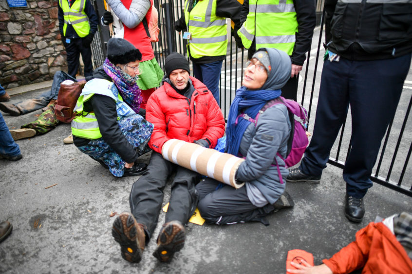 Climate change activists  during a peaceful protest against the way they think the broadcaster covers the 'climate emergency'.
