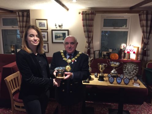 Eden receives her trophy from Angus Provost Ronnie Proctor