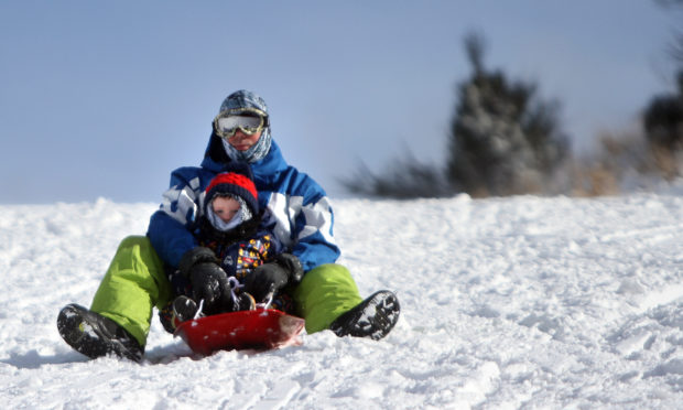 Kevin and Ben Trueland sledging near Balmossie Road. Kris Miller/DCT Media