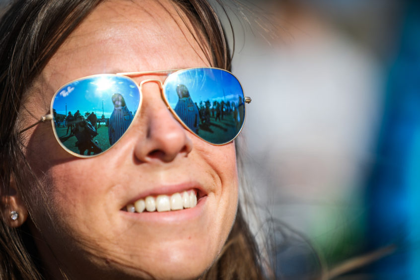 Penguins reflected in Lydia Cockers' sunglasses. Kris Miller/DCT Media