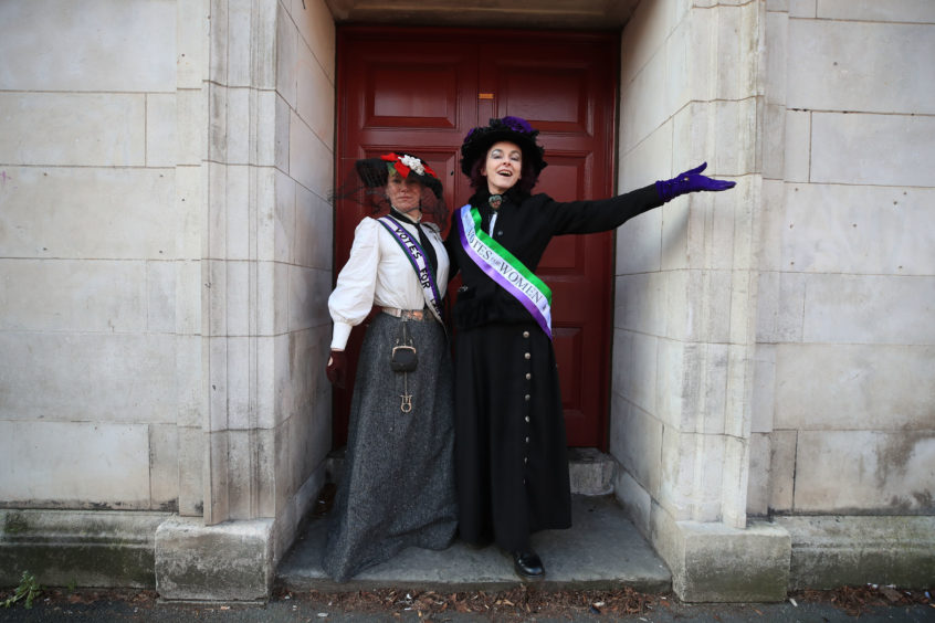 Rosie Garland (right) and Jenny Garside (left) dressed in the uniform of a suffragette, ahead of the unveiling of the Emmeline Pankhurst statue.