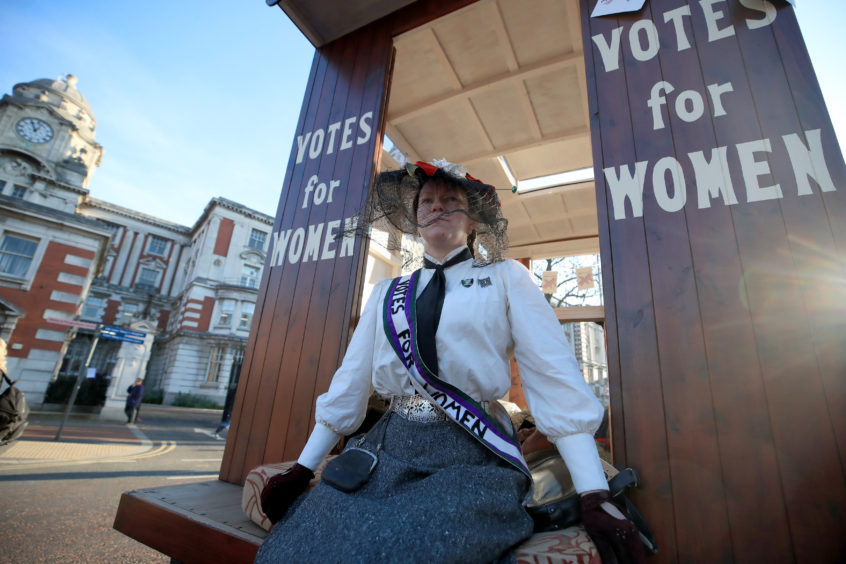 Jenny Garsdie, dressed in the uniform of a suffragette, ahead of the unveiling of the Emmeline Pankhurst statue in St Peter's Square, Manchester.