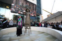 Helen Pankhurst, the great granddaughter of Emmeline Pankhurst, stands next to a statue of Emmeline, by sculptor Hazel Reeves following its unveiling.