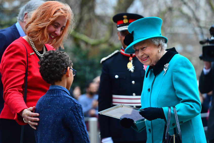 Queen Elizabeth II arrives for a visit to Coram, the UK's oldest children's charity. Victoria Jones/PA Wire