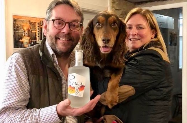 Persie distillery managing director Simon Fairclough at the Spaniel Gin launch with Daniel the spaniel and gin and dog fan Jennifer Elder from Forfar.