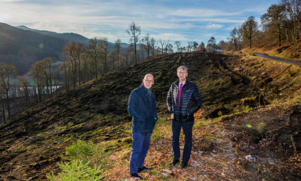 Perthshire North MSP John Swinney and Councillor Mike Williamson next to the B8019