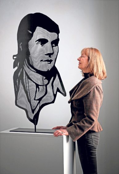 Curator Sheilagh Tennant with a portrait of Robert Burns made from steel mesh by artist David Begbie which features in the Burns Unbroke exhibition at the Summerhall, Edinburgh in 2018