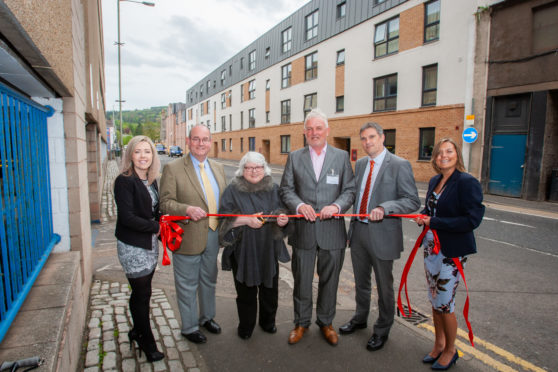 Fairfield's Canal Street development opened in May. From left: Stephanie Joss, corporate administrator, Fairfield, Councillor Bob Brawn, Rena Crighton, chairwoman of, Fairfield, Grant Ager, chief executive of  Fairfield, Stewart Shearer, managing director, Robertson Partnership Homes) and Sharon Bell, corporate manager of Fairfield.