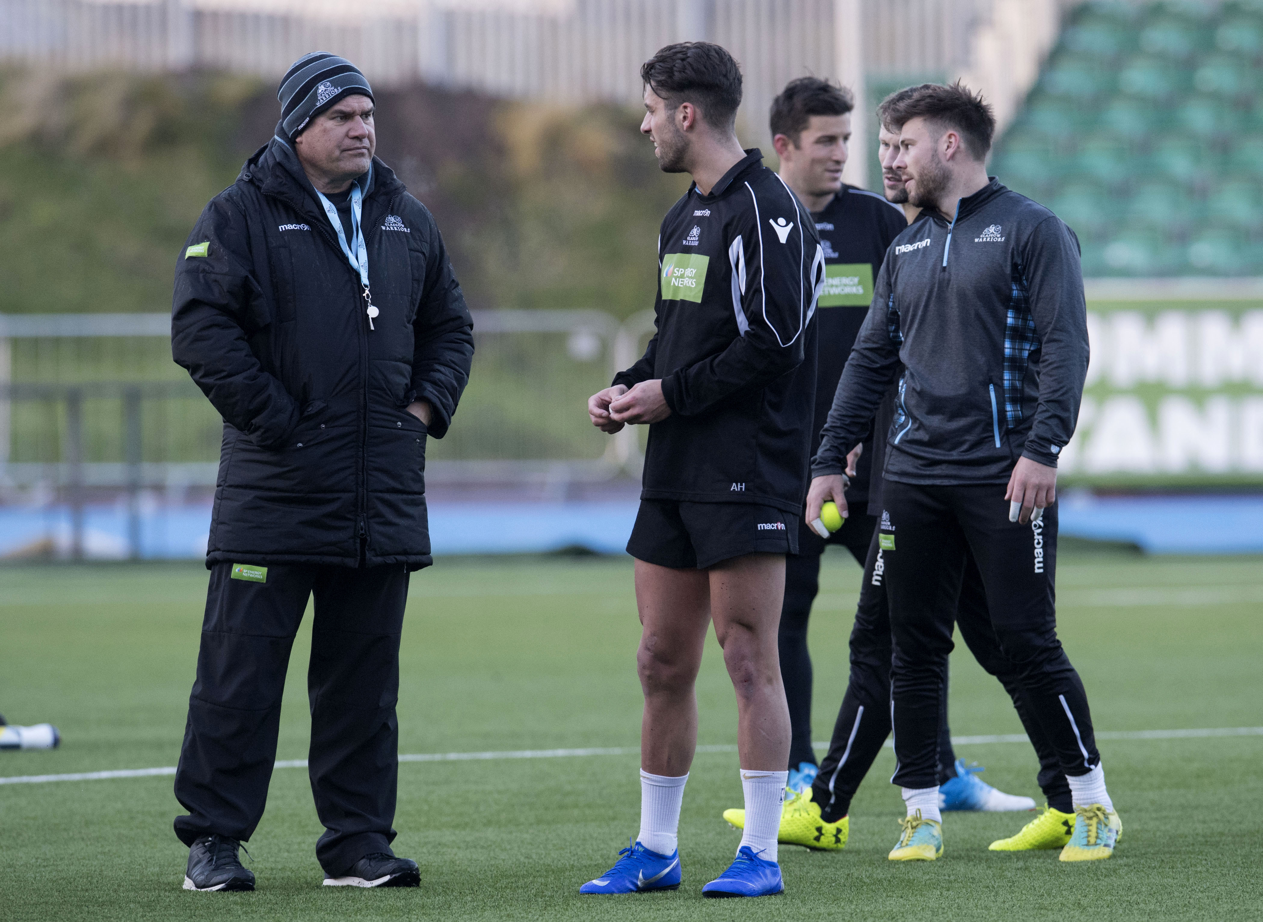 Glasgow Warriors head coach Dave Rennie speaks to Adam Hastings during training at Scotstoun.