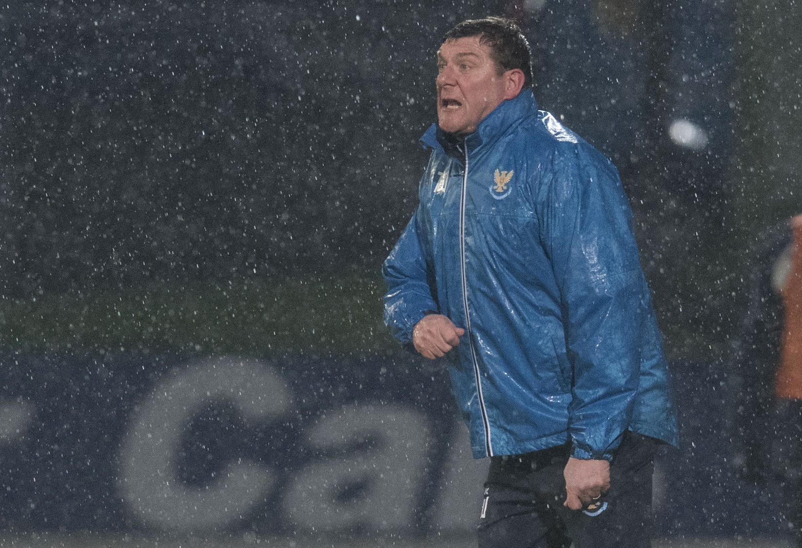 A drenched Tommy Wright urges on his players.
