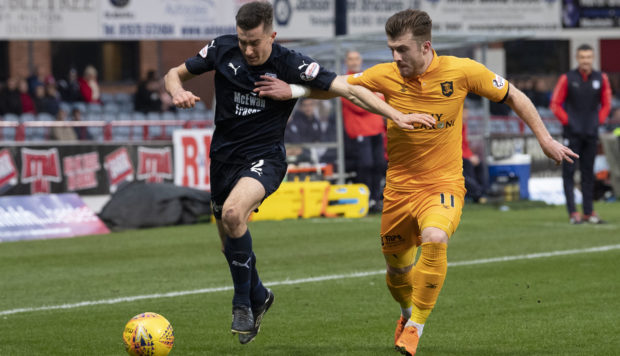 Dundee's Cammy Kerr (left) battles with Livingston's Nicky Cadden.