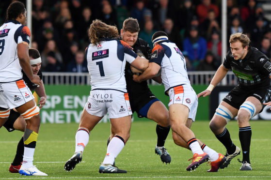 Oli Kebble can;t find a way through against Pierre Schoeman and Stuart McInally at Scotstoun.