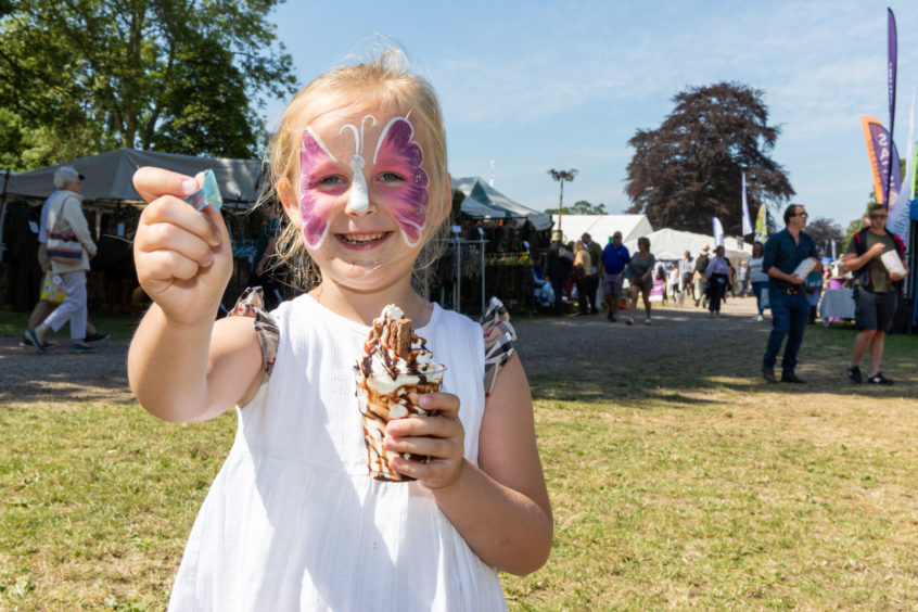 Ava Flett from Perth enjoys an ice cream at Scone Game Fair. Steven Brown/DCT Media