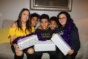 Donna Sangmor with her children Noah (9), Jay(11), Daniel(5) and Anisha(14) with the boxes they have made up for homeless people.