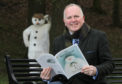 Jamie MacDougall, presenter of this year's RSNO Christmas concerts, with the Snowman.