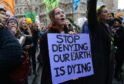 Environmental protesters of Extinction Rebellion group take part in a demonstration outside BBCs headquarters in London on December 21 2018