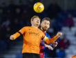 Dundee United captain Fraser Fyvie and Inverness's  Joe Chalmers compete for a header.