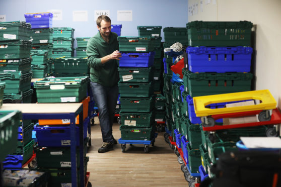 Dundee Foodbank stock coordinator Michael Calder sorting donations.