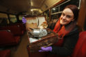 Museum manager Sam Walker with the ticket machine.