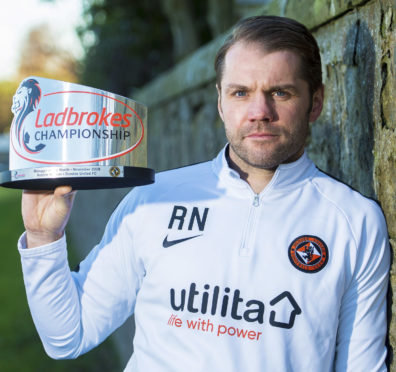Robbie Neilson with his manager of the month award.