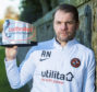 Robbie Neilson with his manager of the month award.