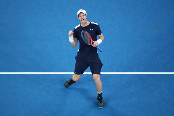 The crowd are on their feet and Murray's fist is in the air as he takes the third set.
