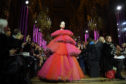 A heavily pregnant Erin O'Connor walks the Paris runway wearing a stacked pink tulle gown during the Schiaparelli Spring Summer 2019. Not your usual maternity dress.
