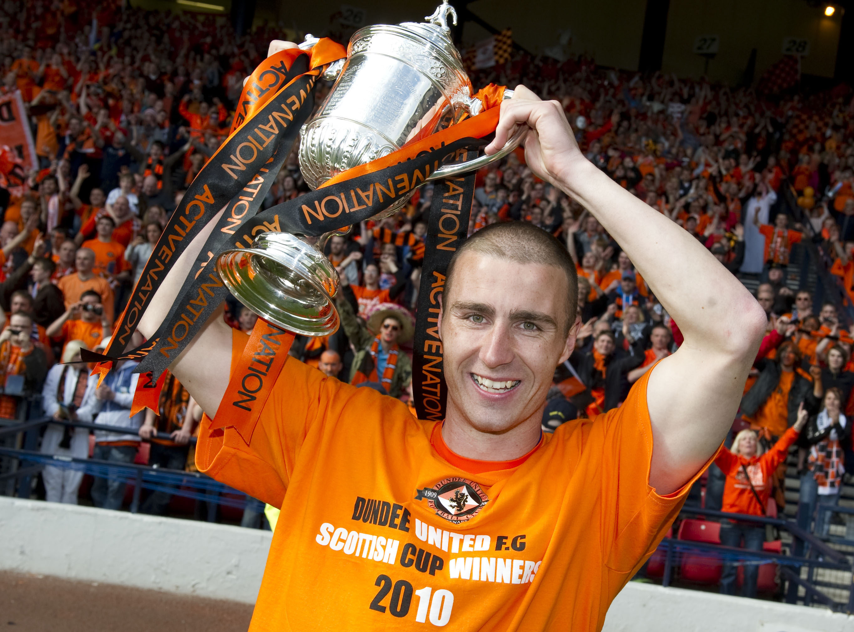 Sean Dillon raises the Scottish Cup in 2010.