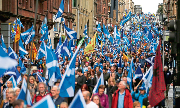 Thousands of people taking part in the 'All Under One Banner' march for Scottish independence through Glasgow city centre.