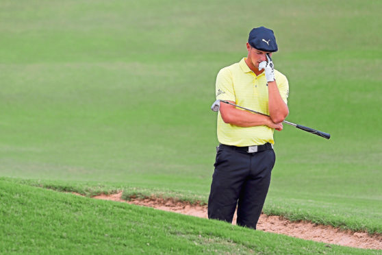 LAHAINA, HI - JANUARY 05:  Bryson DeChambeau of the United States reacts on the 12th hole during the third round of the Sentry Tournament of Champions at the Plantation Course at Kapalua Golf Club on January 5, 2019 in Lahaina, Hawaii.  (Photo by Kevin C. Cox/Getty Images)