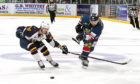 Dundee Stars' Matt Marquardt gets his shot away before Flames Jesse Craige can close him down.