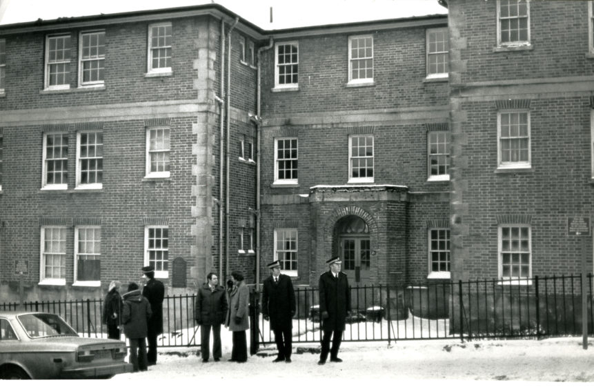 Police outside the flats at 2B Kinghorne Road following the grim discovery in 1979. Image: DC Thomson.