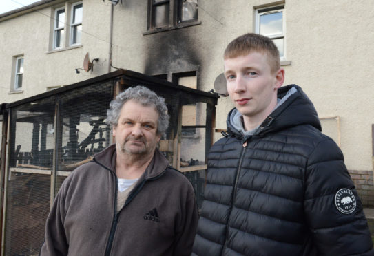 Aviary owner William Dickson (left) and neighbour Steven Bell who raised the alarm