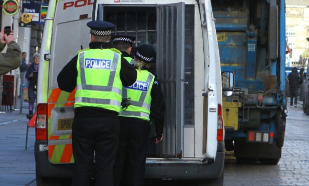 Police arresting one of the Brassica protesters.