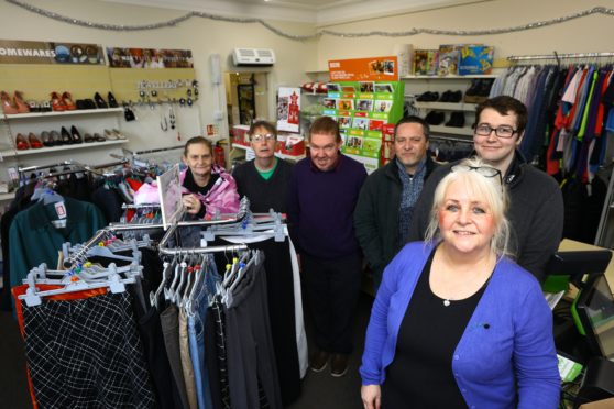 Shop Manager Lynda Stuart, front, with volunteers L/R, Wendy Bruce, Sandy Simpson, Ben Herschell, Colin Reid and Kieron Calder inside the last Oxfam shop in Angus