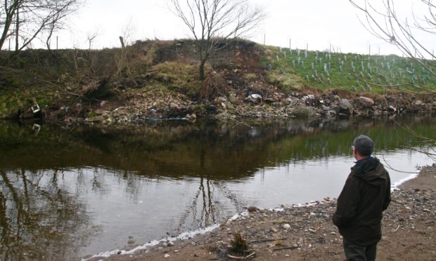 Robert Kellie assesses beaver damage at River Ericht.