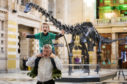 Oliver Cudden, 6, from Glasgow, with his father Andrew Cudden, was one of the first people to see Dippy, the Natural History Museum London's famous diplodocus skeleton, as it was unveiled at Kelvingrove Art Gallery and Museum in Glasgow.