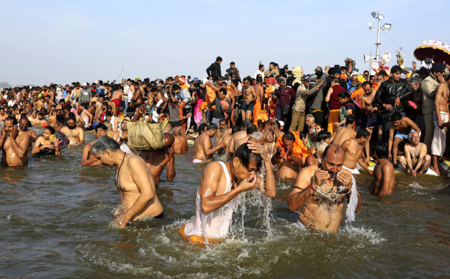 Hindus take ritualistic dips on Makar Sankranti day during the festival.