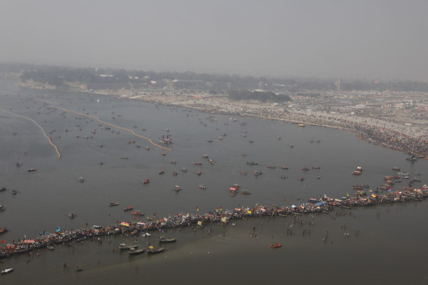An aerial view of Kumbh city at Sangam, on the auspicious day of "Paush Purnima" during Kumbh Mela or Pitcher Festival at Prayagraj, India, .The Kumbh Mela is a series of ritual baths by Hindu holy men, and other pilgrims at the confluence of three sacred rivers the Yamuna, the Ganges and the mythical Saraswati that dates back to at least medieval times.
