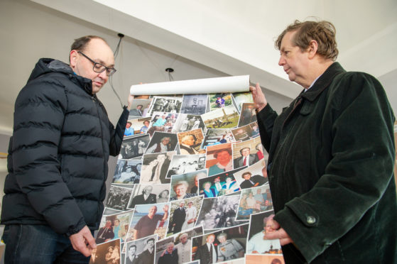 Grant Hutchison (Tustee of the Charity) gives a sneak preview of the wallpaper which will adorn the new venue to Paul Roberts (Secretary of the City of Brechin Civic Trust).