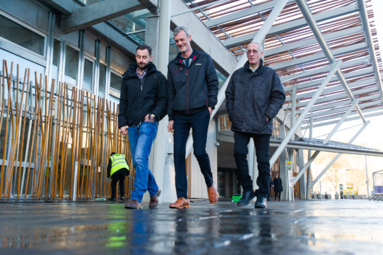 Former HES workers Stuart McSorley, Billy Robertson and Mike Dowling at Holyrood