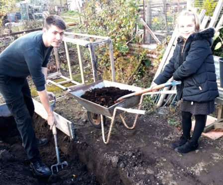 Kyle and Scarlet digging and composting