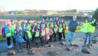Pictured Darren Noble, right from Neptune and parent Dave Goulding with the vests and pupils in the vest.